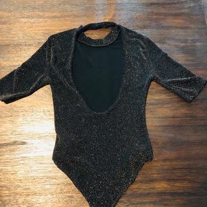 Gold sparkly body suit